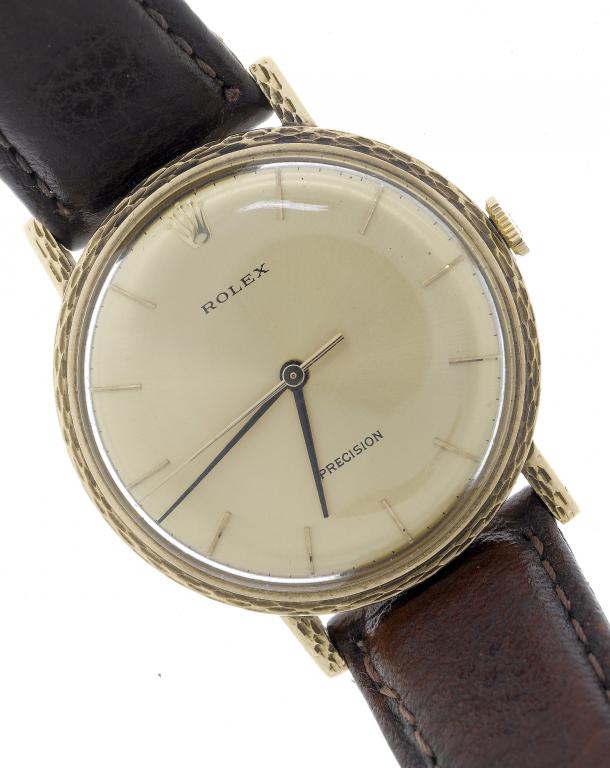 Appraisal: A ROLEX GOLD GENTLEMAN'S WRISTWATCH the gilt dial with bar