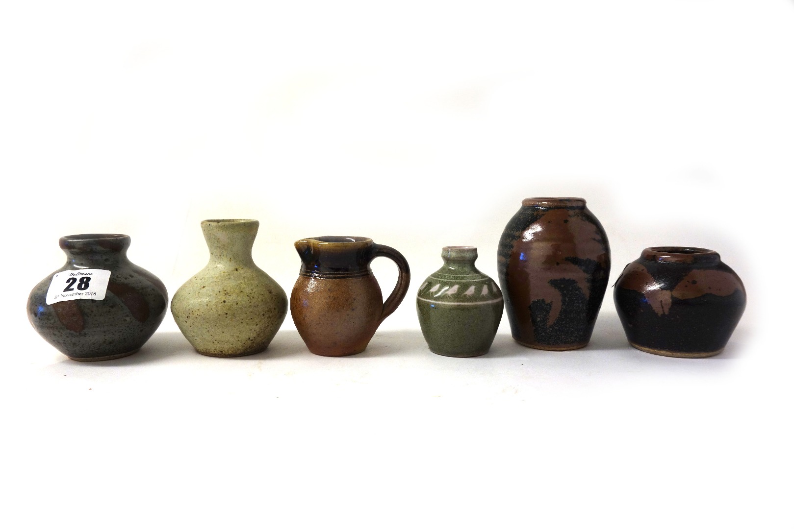 Appraisal: Four small John Leach stoneware vases each with differing glaze