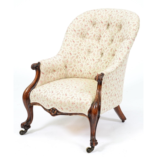 Appraisal: A Victorian walnut armchair in buttoned upholstery and brass castors