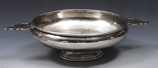 Appraisal: A SILVER ARTS AND CRAFTS QUAICH with two pierced handles