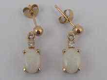 Appraisal: A pair of yellow metal tests ct gold opal and