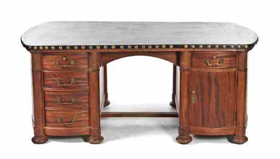 Appraisal: An American Neoclassical Style Executive's Desk having a rectangular leather