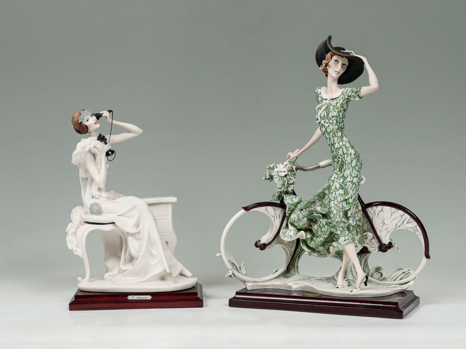 Appraisal: PAIR OF GIUSEPPE ARMANI ART DECO FIGURES Comprising - Woman