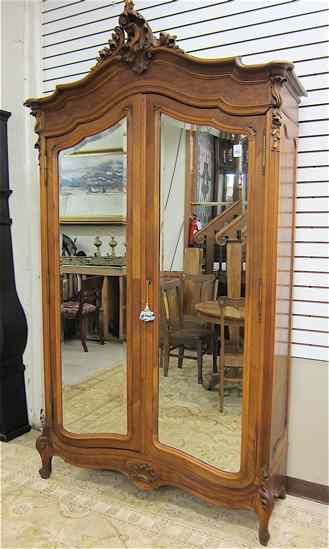 Appraisal: LOUIS XV STYLE TWO-DOOR ARMOIRE French c the molded arch