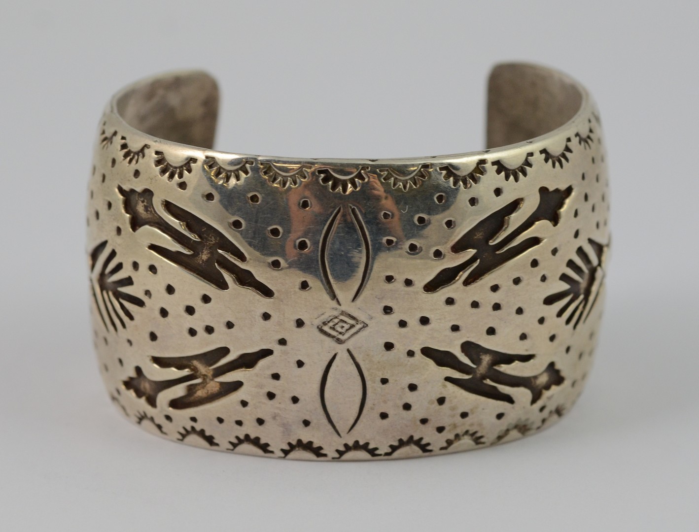 Appraisal: Frank Benally Navajo sterling cuff bracelet carved with stampwork purchased