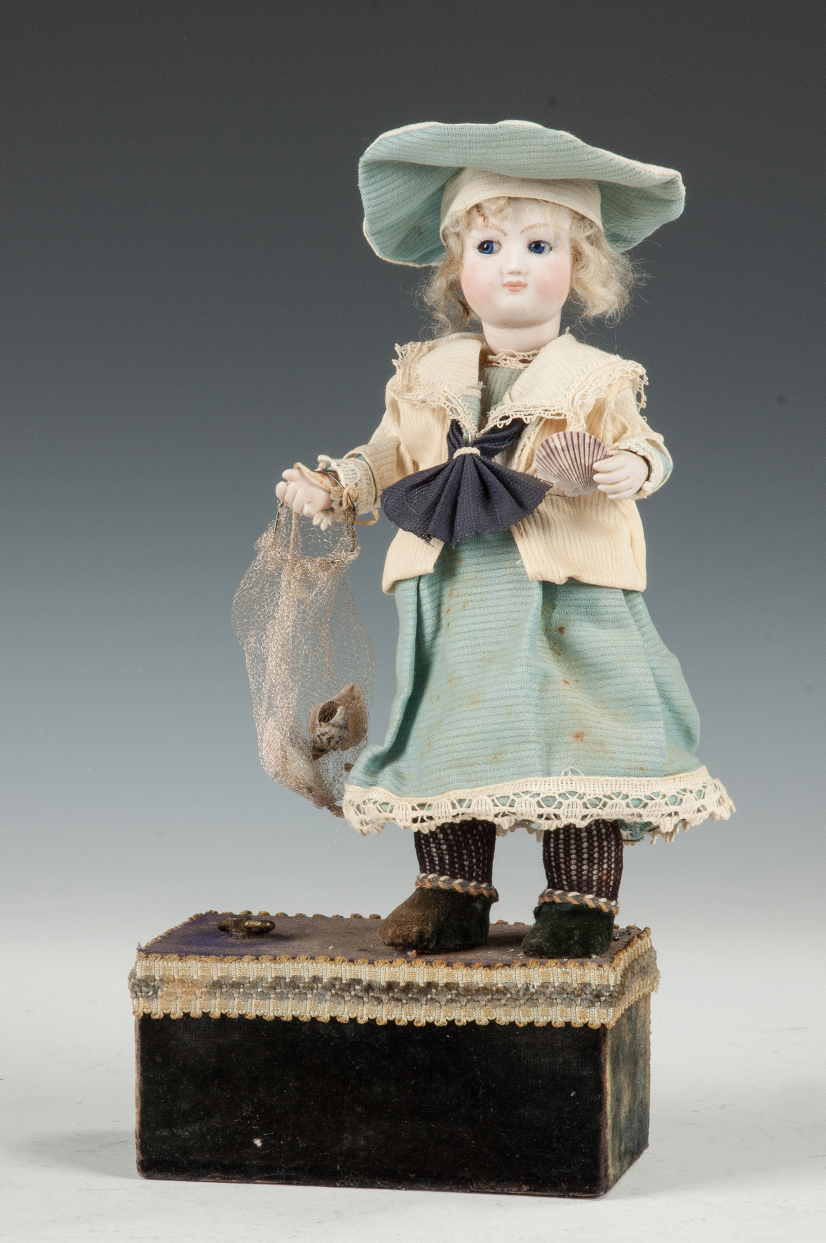 Appraisal: German Automaton Doll with Seashells C Bisque head blown glass