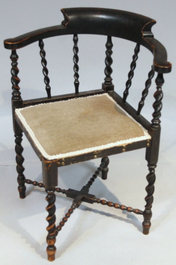 Appraisal: An early thC ebonised bobbin back corner chair with heavy