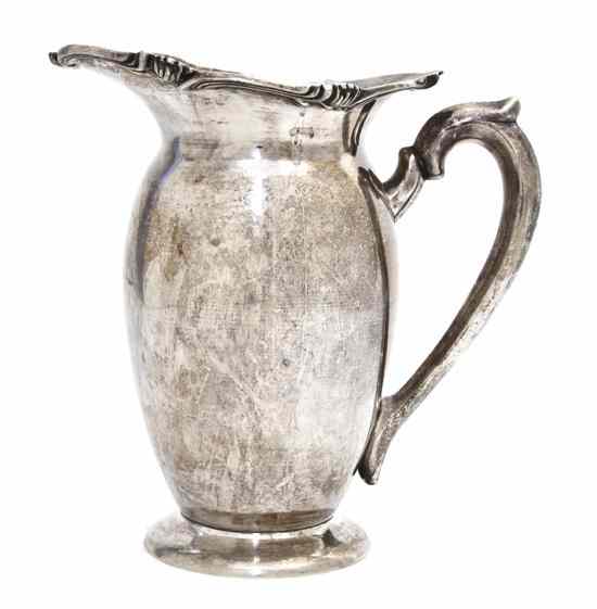 Appraisal: A Peruvian Silver Water Pitcher Welsh of ovoid handled form