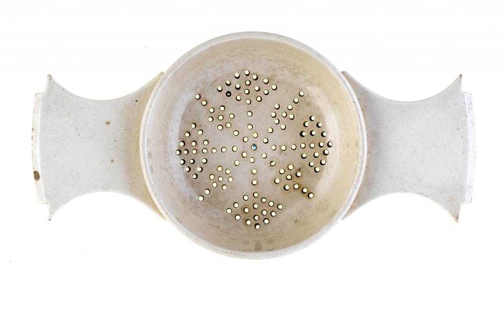 Appraisal: A CREAMWARE STRAINER of 'silver' form with shaped lug handles