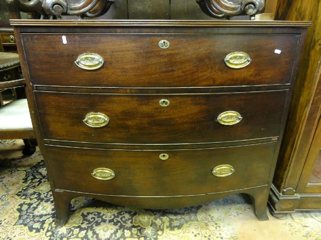 Appraisal: A Georgian mahogany bow fronted chest fitted with three long