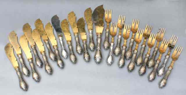 Appraisal: A SET OF TWELVE RUSSIAN SILVER KNIVES AND FORKS gilt