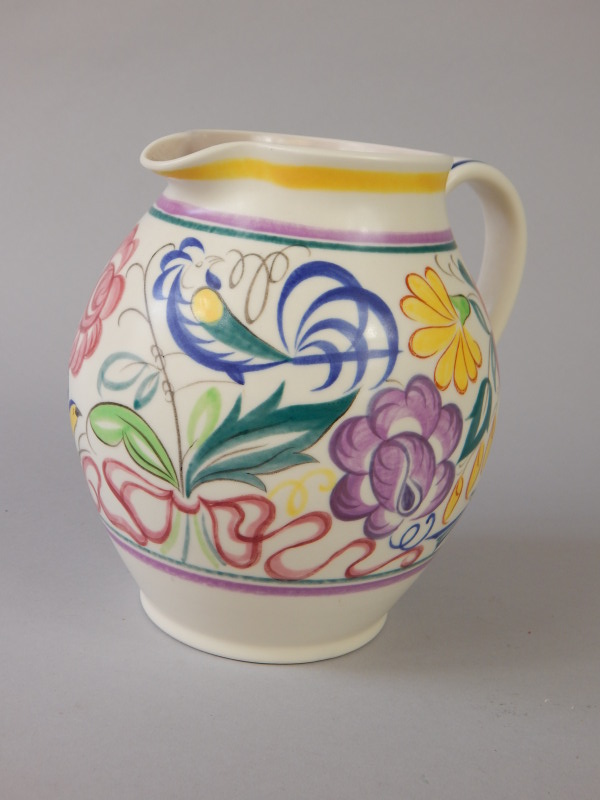 Appraisal: A Poole pottery jug with hand painted band of flowers