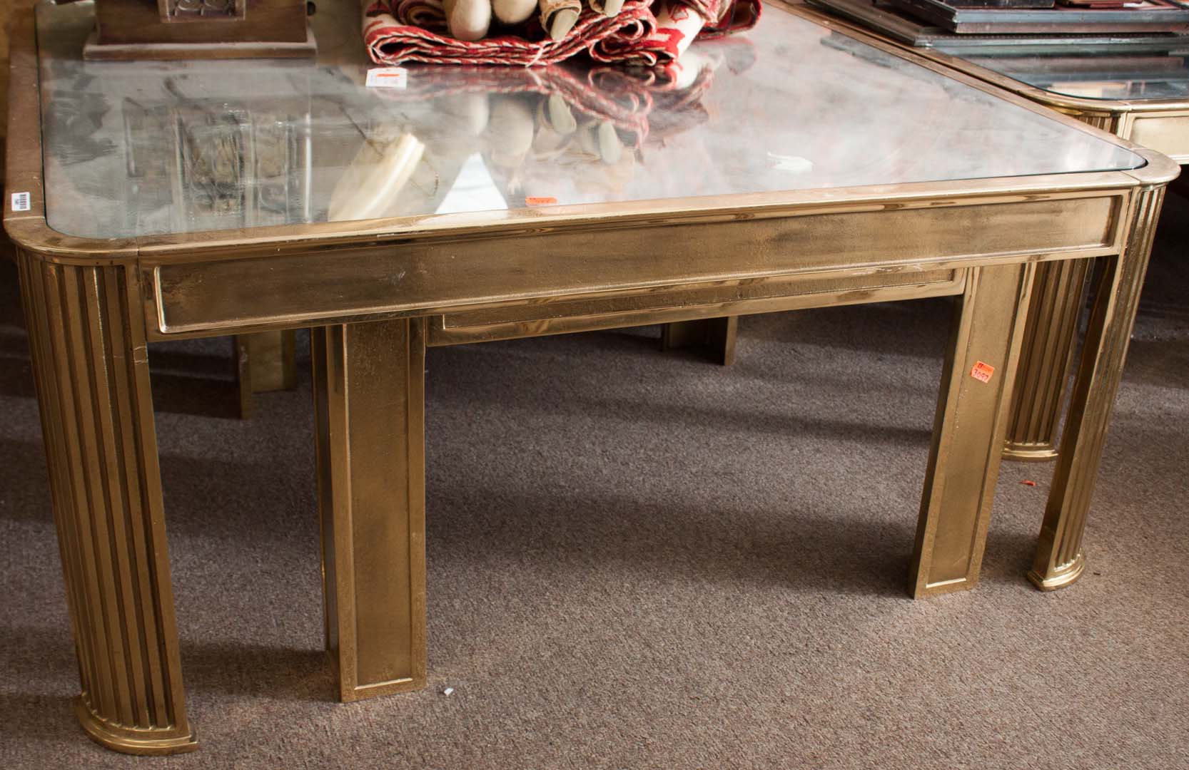 Appraisal: Three brass and glass coffee tables