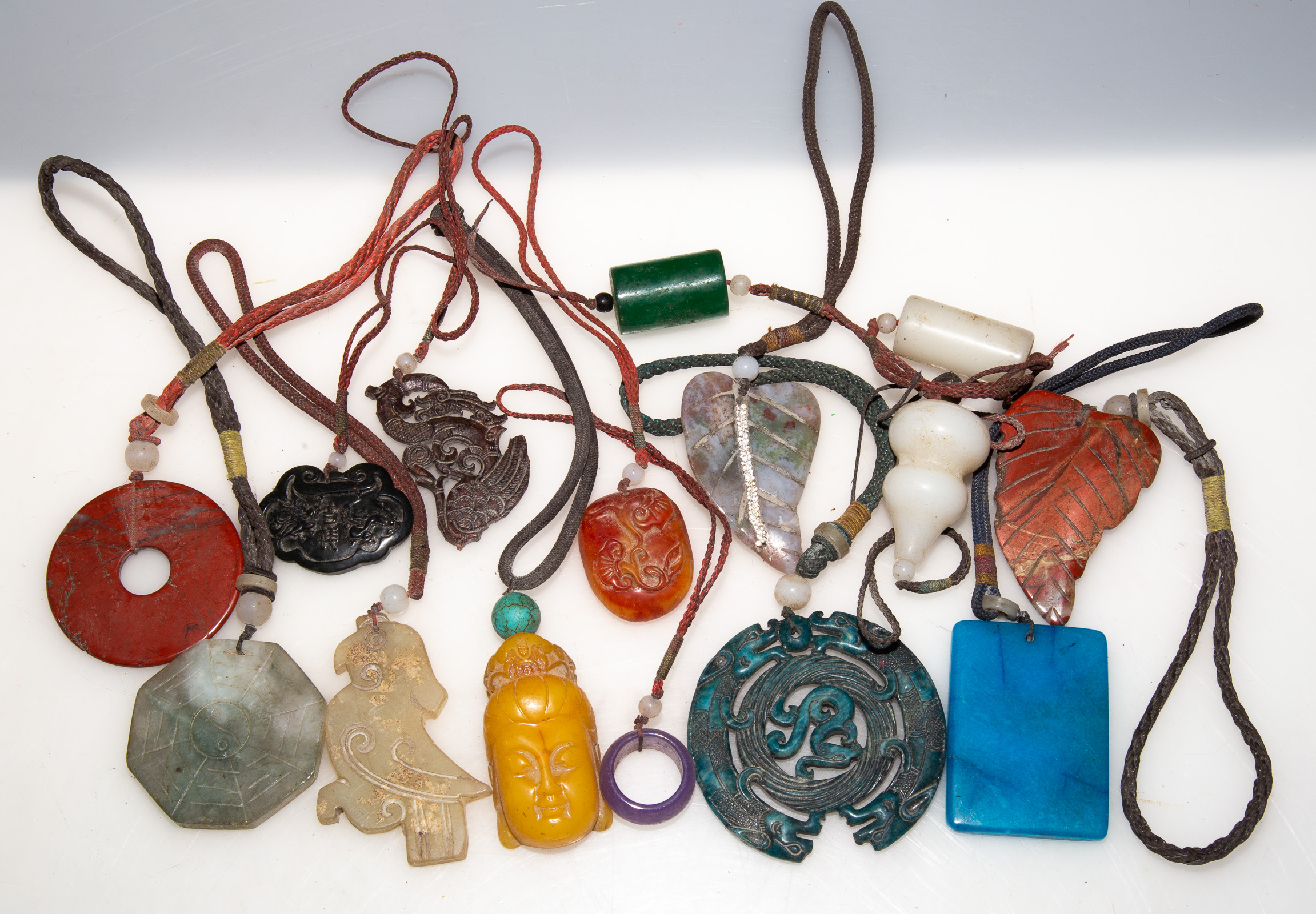 Appraisal: ASSORTED CHINESE CARVED STONE PENDANTS th century