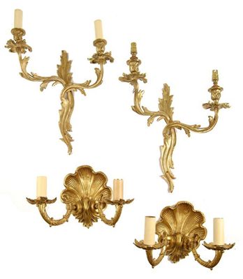 Appraisal: A pair of gilt brass two branch wall lights of