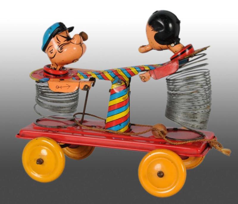 Appraisal: Tin Linemar Popeye Olive Oyl Slinky Hand Car Toy Description