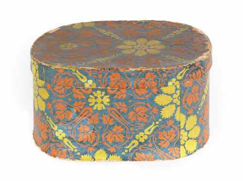 Appraisal: Oval wallpaper box th c with orange and yellow floral