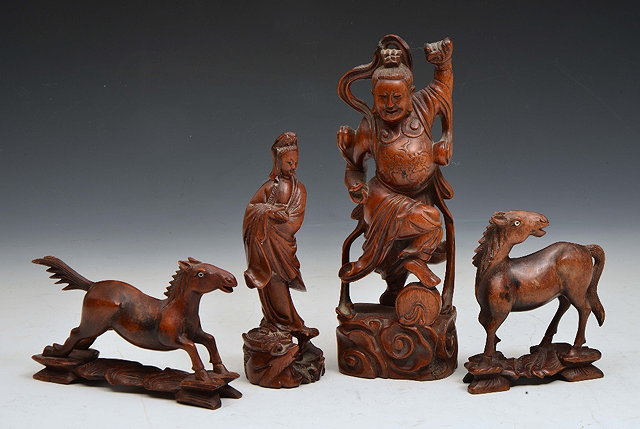 Appraisal: FOUR CHINESE BOXWOOD CARVINGS Guanyin Guandi and two horses inscribed