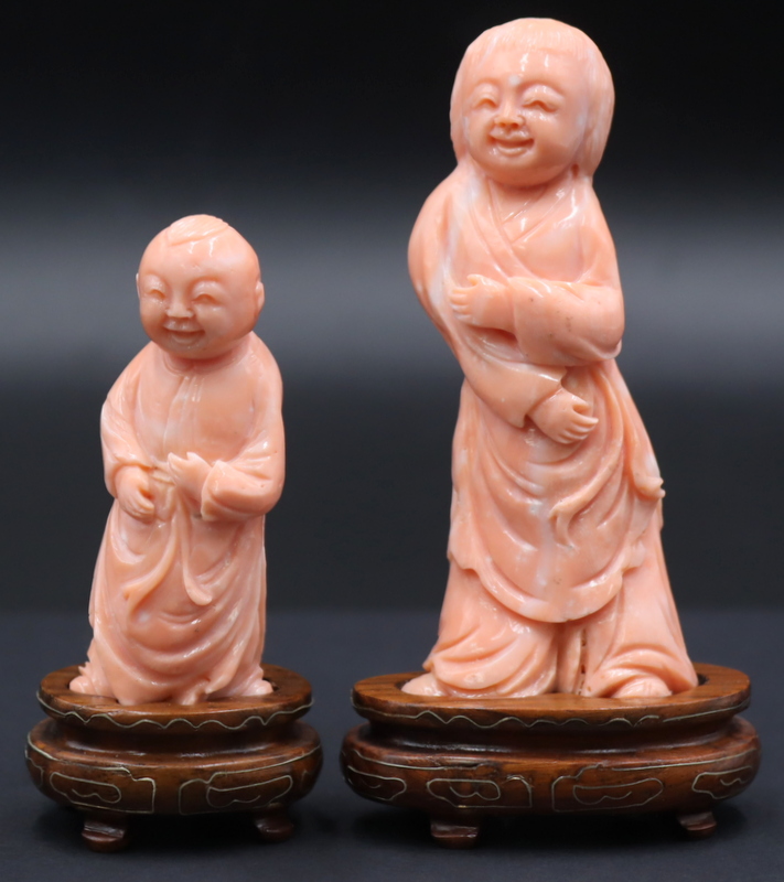 Appraisal: CARVED ANGEL SKIN CORAL STANDING FIGURES OF Children Includes standing