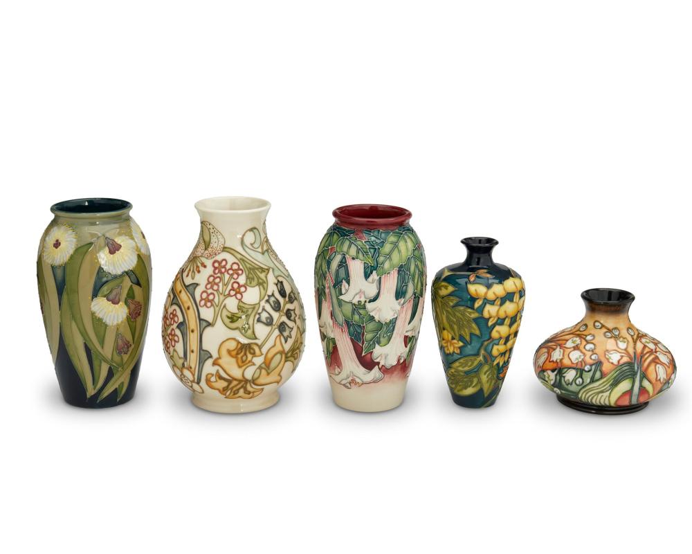 Appraisal: A GROUP OF MOORCROFT POTTERY VASESA group of Moorcroft pottery