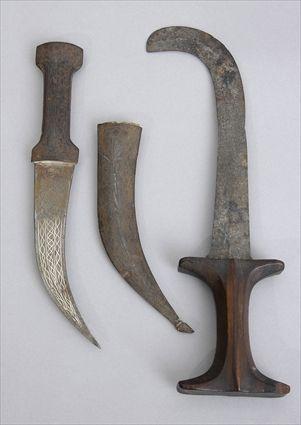 Appraisal: INLAID BRONZE DAGGER AND SHEATH AND A WOOD-HANDLED STEEL DAGGER