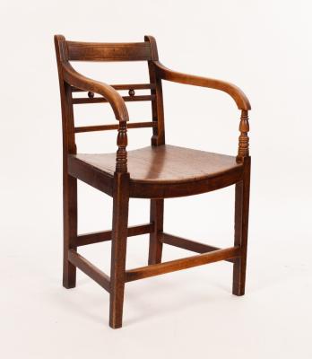 Appraisal: A mid th Century fruitwood armchair the triple horizontal stick