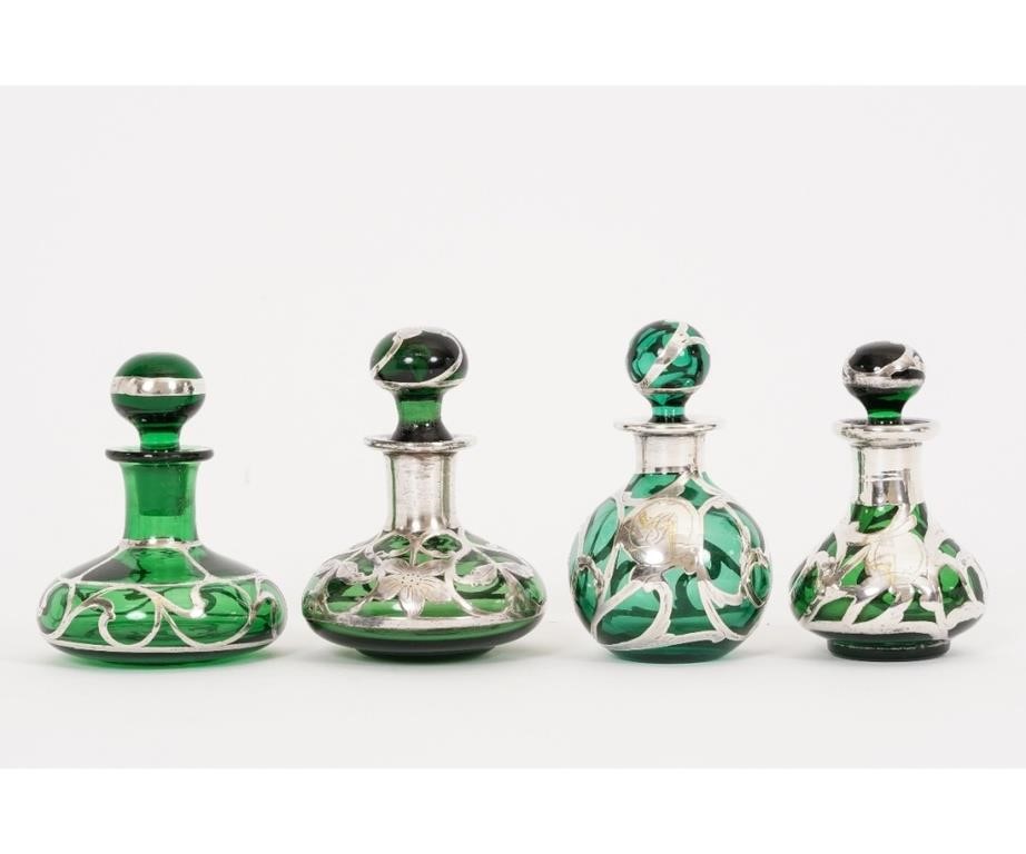 Appraisal: Four silver overlay green glass perfume bottles circa one with