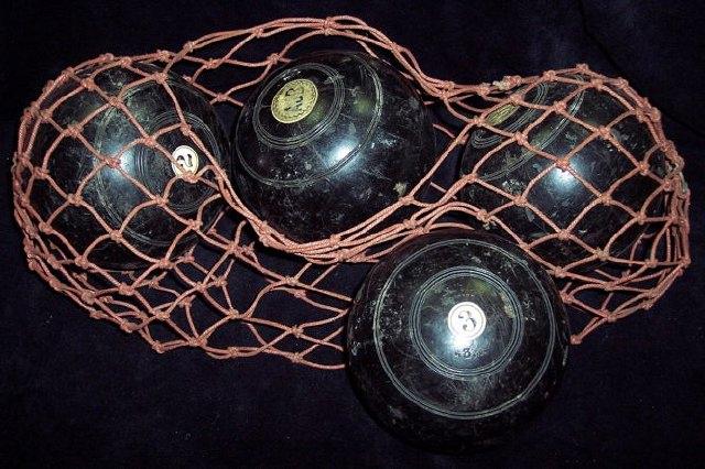 Appraisal: A set of four lawn bowls numbered -