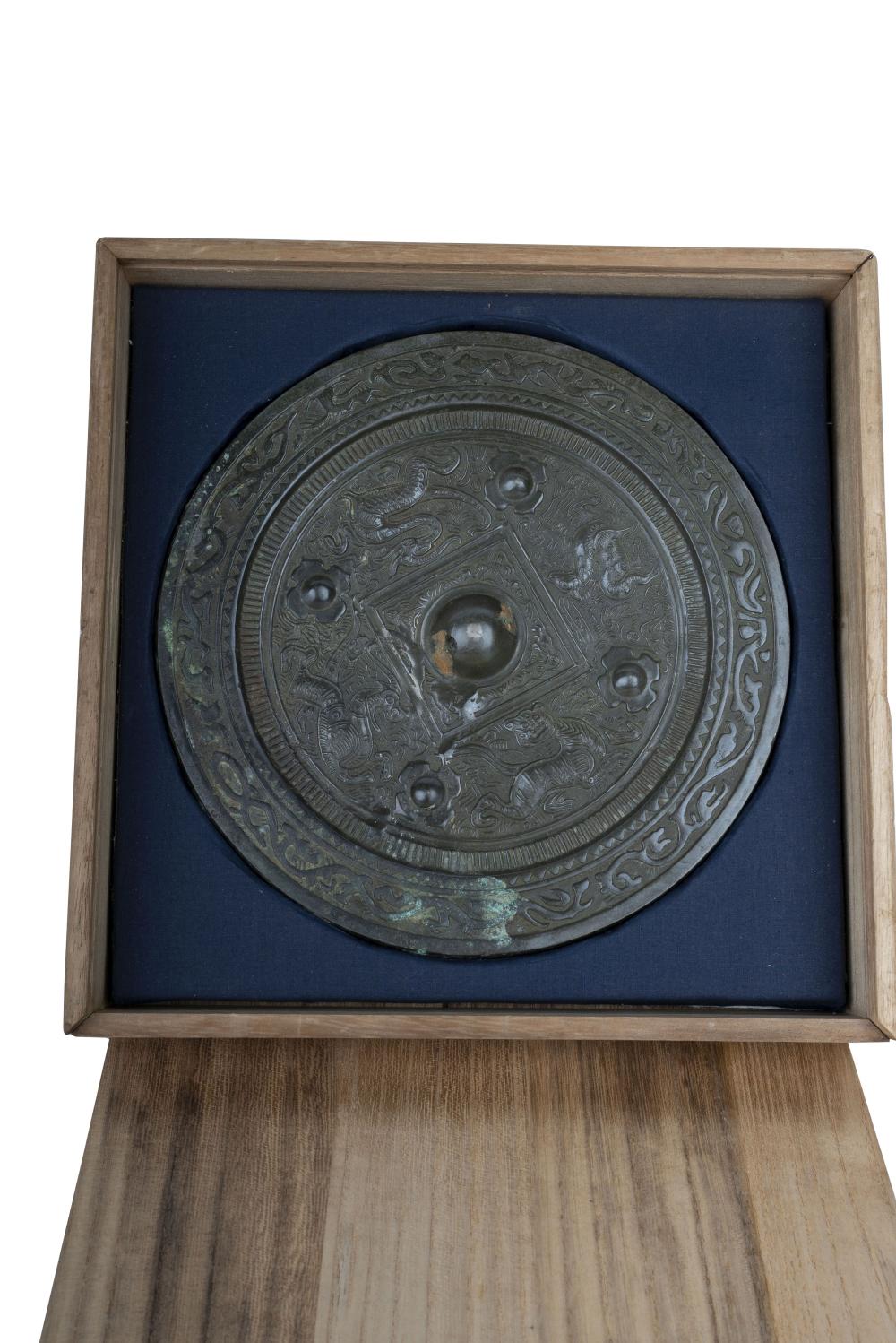 Appraisal: CHINESE ARCHAIC STYLE BRONZE HAND MIRRORwith a fitted wood box