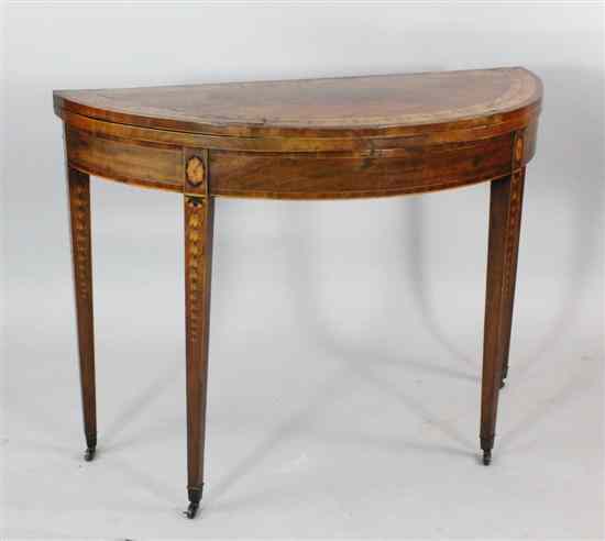 Appraisal: A George III mahogany and marquetry demi lune card table