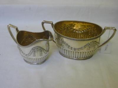 Appraisal: A VICTORIAN SUGAR AND CREAM SET of half fluted oval