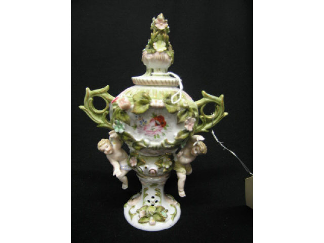 Appraisal: Fine Porcelain Covered Urn cherub decor applied flowers