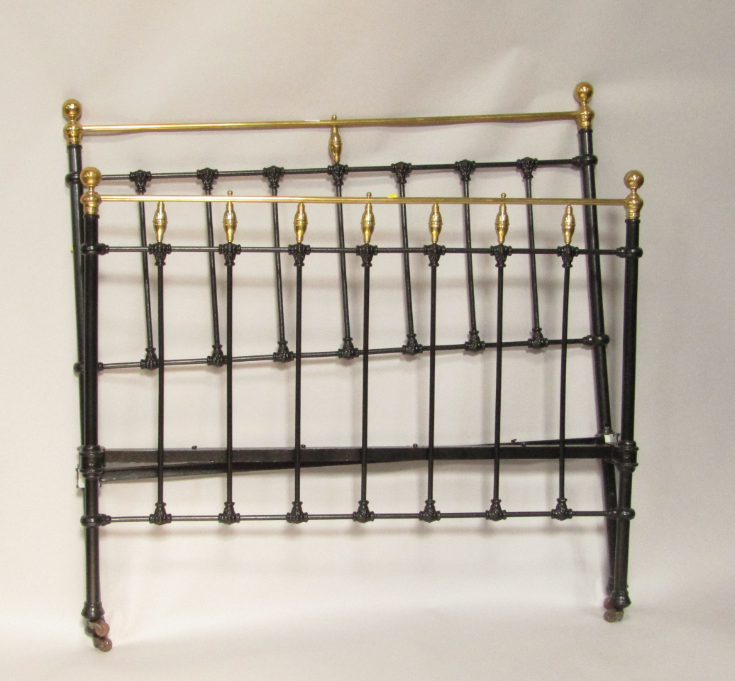 Appraisal: A Victorian brass and cast iron double bed frame with