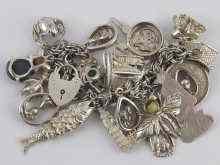 Appraisal: A white metal tests silver charm bracelet comprising approx charms