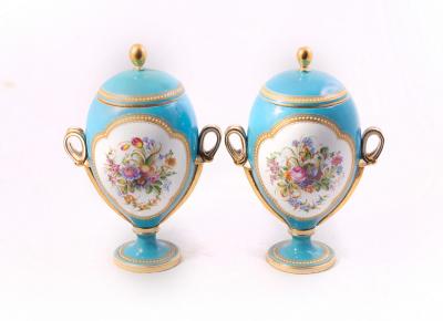 Appraisal: A pair of ovoid porcelain vases and covers circa each