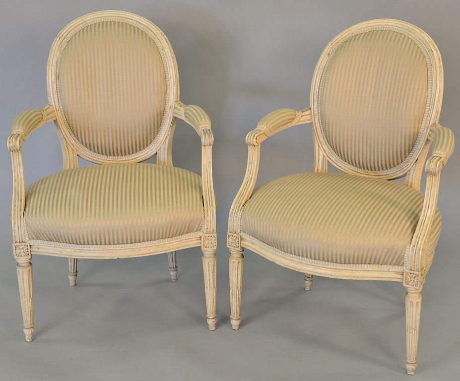 Appraisal: Pair of Louis XVI style cream painted fauteuils having oval