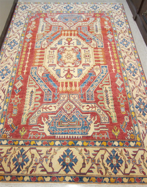 Appraisal: HAND KNOTTED ORIENTAL CARPET Pakistani Caucasian overall geometric design on