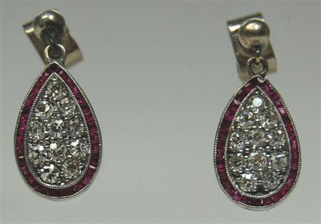 Appraisal: A pair of ruby and diamond pendant earrings each with