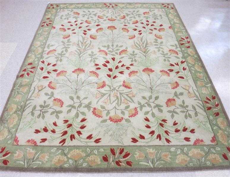 Appraisal: HAND TUFTED ORIENTAL CARPET overall floral design on light beige