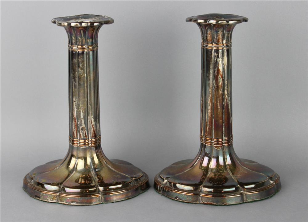 Appraisal: PAIR OF SHEFFIELD PLATED OVAL REEDED CANDLESTICKS early th C