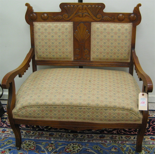 Appraisal: LATE VICTORIAN OAK SETTEE AND MATCHING ARMCHAIR American c the