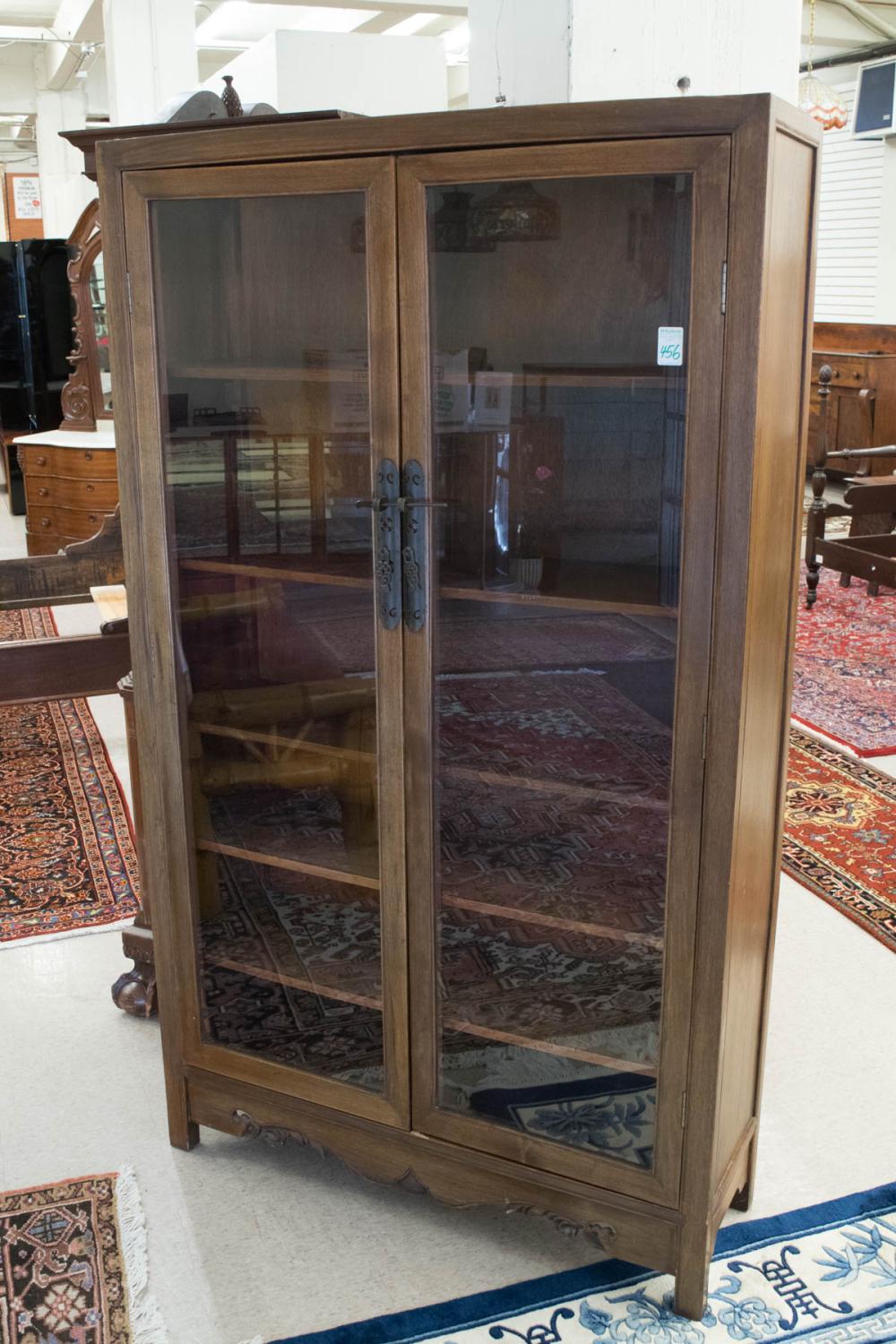 Appraisal: TWO-DOOR TEAK CABINET BOOKCASE Chinese export th century having five