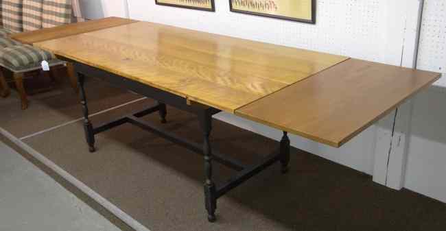 Appraisal: Stretcher base farm table with two leaves that insert at