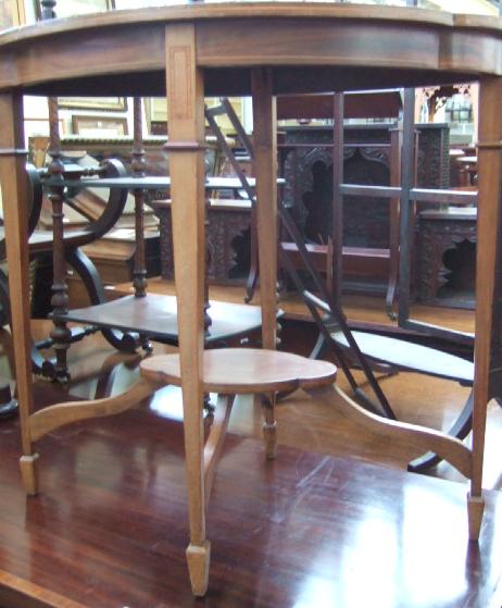 Appraisal: An Edwardian mahogany inlaid two tier occasional table of quadralobe