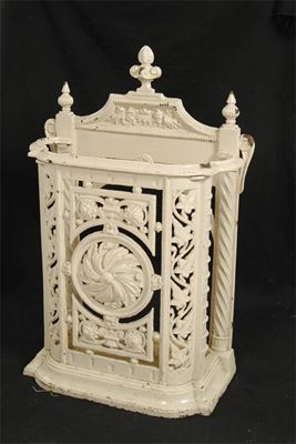 Appraisal: A cast iron stick stand with a lift-out tray early