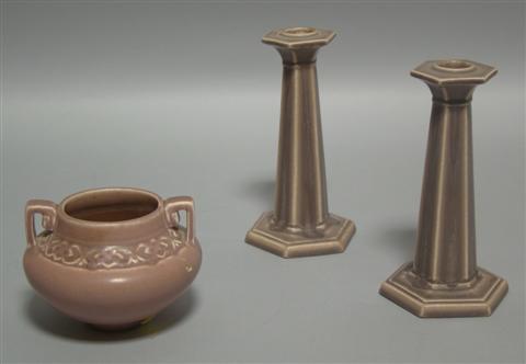 Appraisal: THREE ROOKWOOD MATTE-GLAZE PIECES The first a pair of candlestick