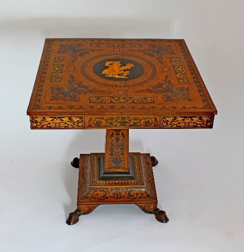 Appraisal: An Italian th Century marquetry and ebonised centre table inlaid