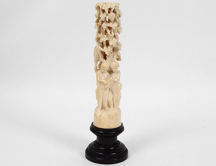 Appraisal: GERMAN CARVED IVORY FIGURES IN A VINEYARDCirca Carved as towering