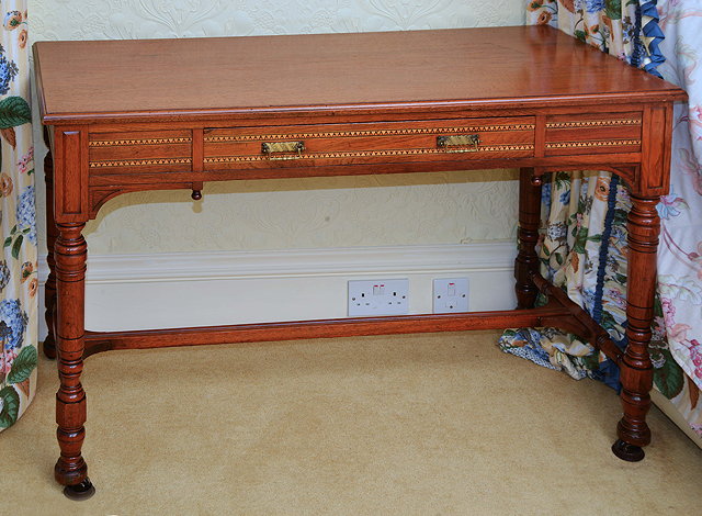 Appraisal: A VICTORIAN WALNUT SIDE TABLE with parquetry banded decoration to