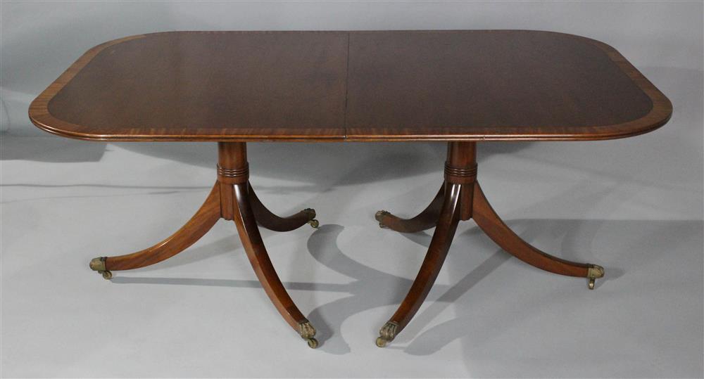 Appraisal: GEORGIAN STYLE INLAID MAHOGANY DOUBLE PEDESTAL DINING TABLE having a